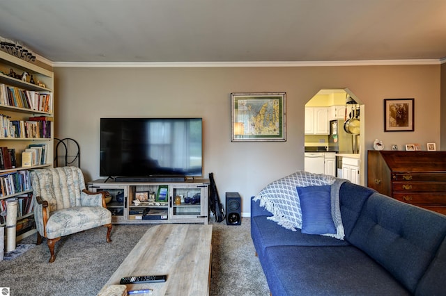 carpeted living room featuring crown molding