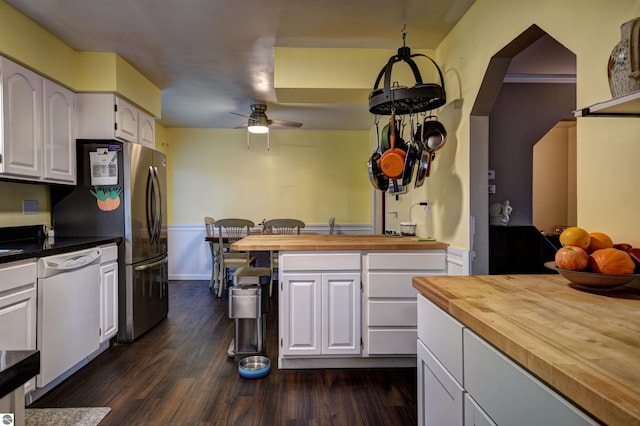 kitchen featuring white cabinetry, dishwasher, ceiling fan, dark hardwood / wood-style flooring, and butcher block countertops