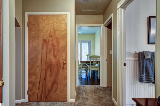 hallway with carpet flooring