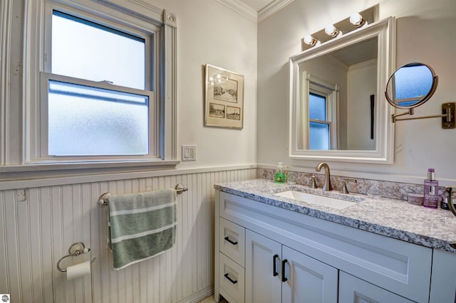 bathroom featuring vanity, plenty of natural light, and crown molding