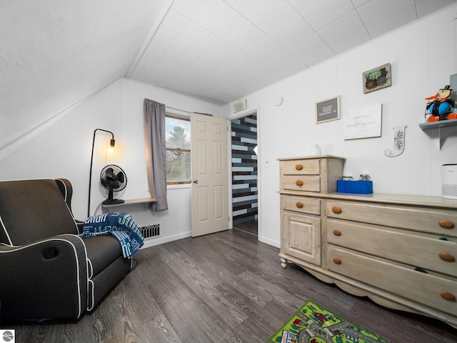 sitting room featuring lofted ceiling and dark hardwood / wood-style floors