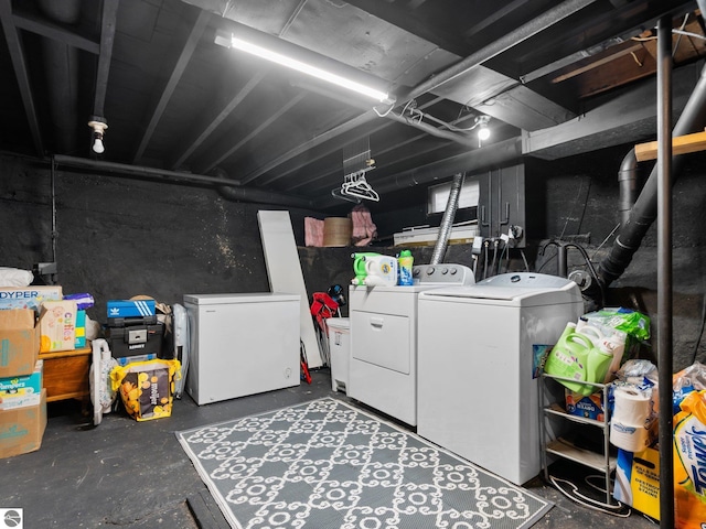 basement featuring washer and dryer and refrigerator