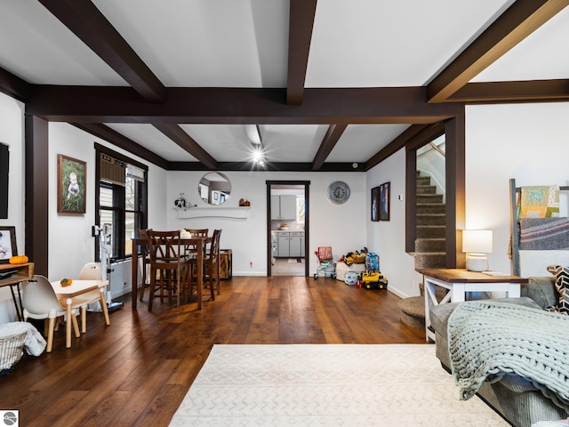 bedroom featuring beamed ceiling and dark wood-type flooring