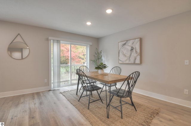 dining space featuring light wood-type flooring