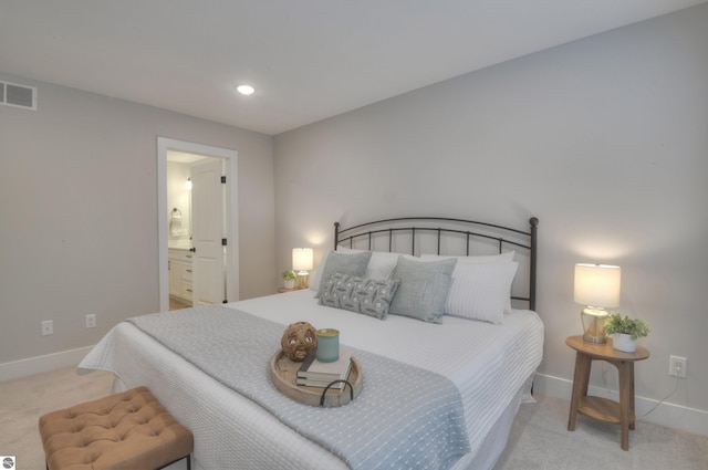 carpeted bedroom with connected bathroom