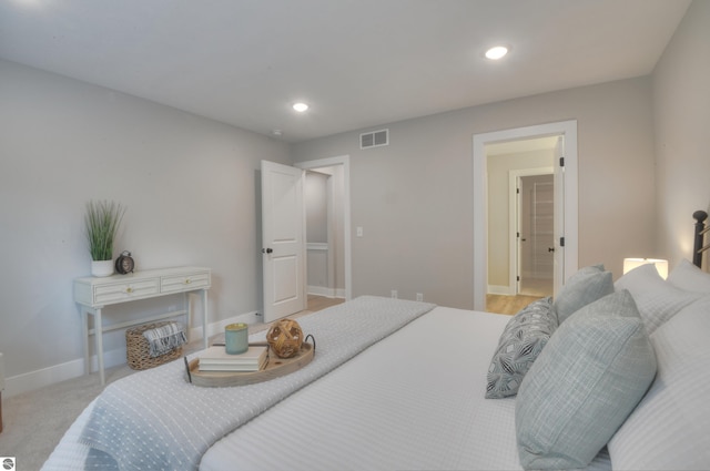 bedroom featuring light colored carpet