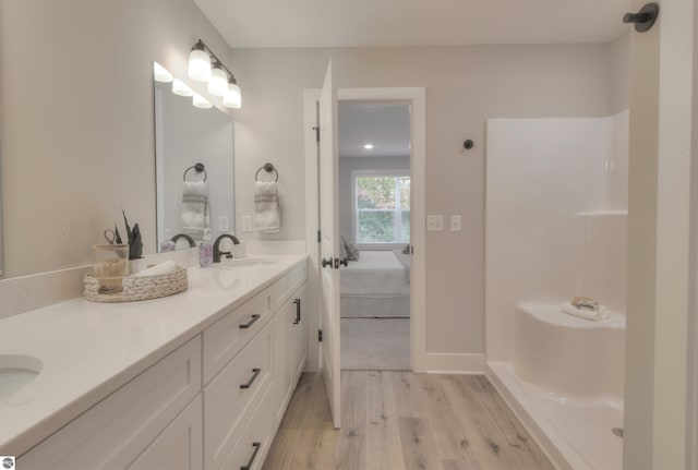 bathroom featuring hardwood / wood-style floors and vanity