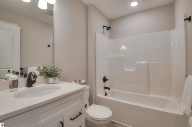 full bathroom with vanity, toilet, and shower / tub combination