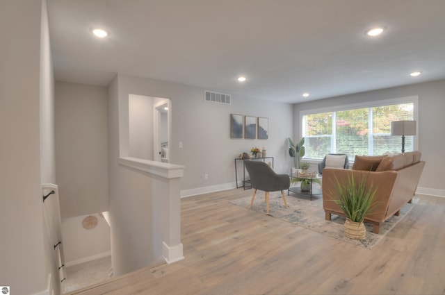 living room with light hardwood / wood-style flooring