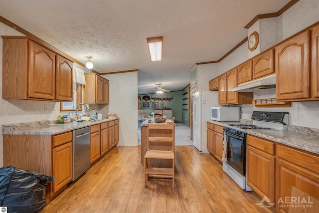 kitchen with white appliances, crown molding, ceiling fan, a textured ceiling, and light hardwood / wood-style floors