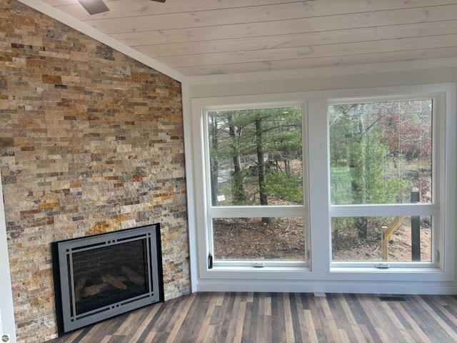 unfurnished living room with hardwood / wood-style floors, plenty of natural light, and lofted ceiling