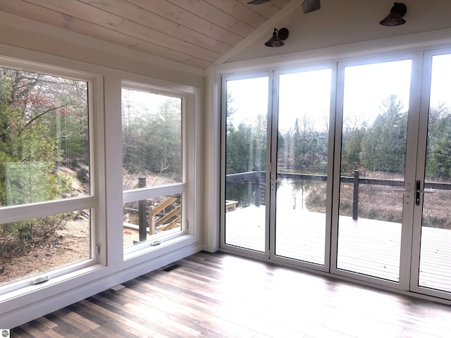 unfurnished sunroom featuring wooden ceiling and vaulted ceiling