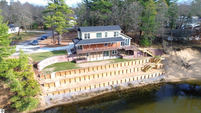 birds eye view of property featuring a water view