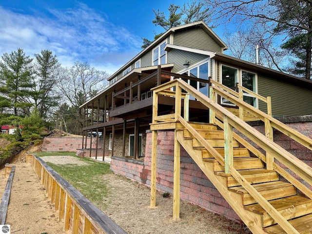 view of side of home with a wooden deck