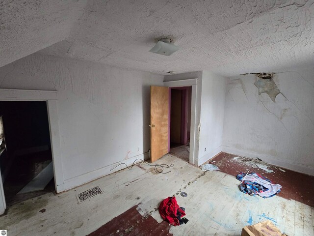 bonus room featuring lofted ceiling