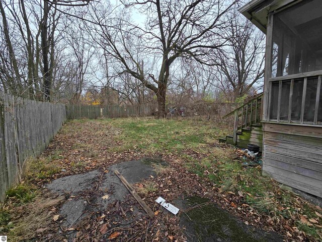 view of yard with a sunroom