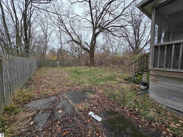 view of yard featuring a sunroom