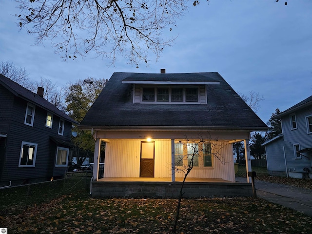 back of house with covered porch