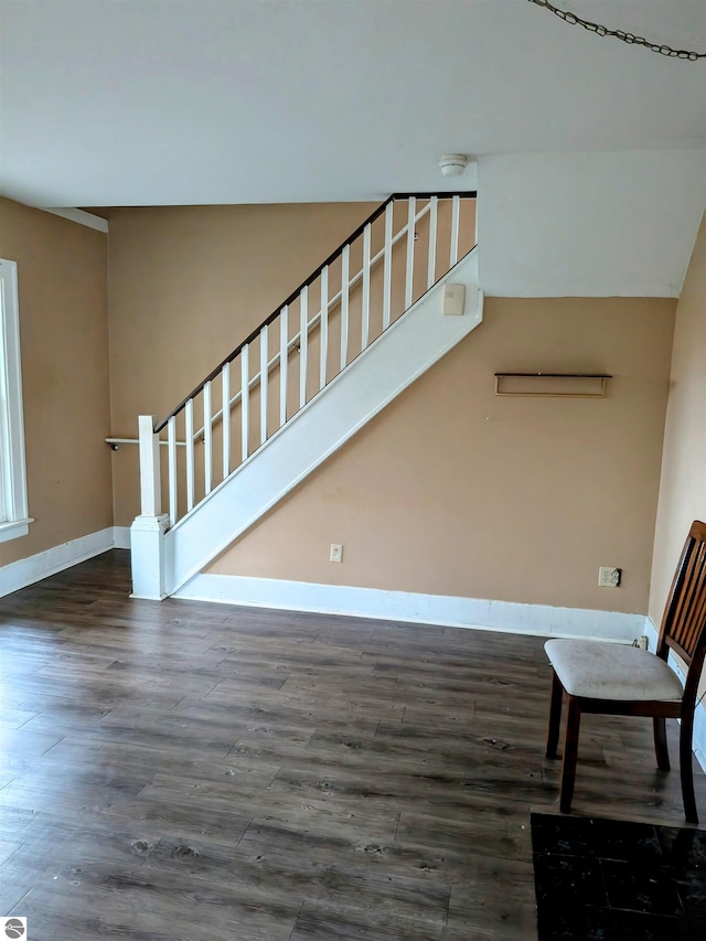 stairs with hardwood / wood-style floors