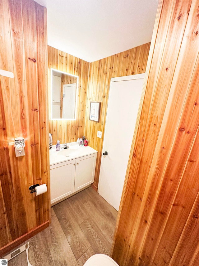 bathroom featuring vanity and hardwood / wood-style floors