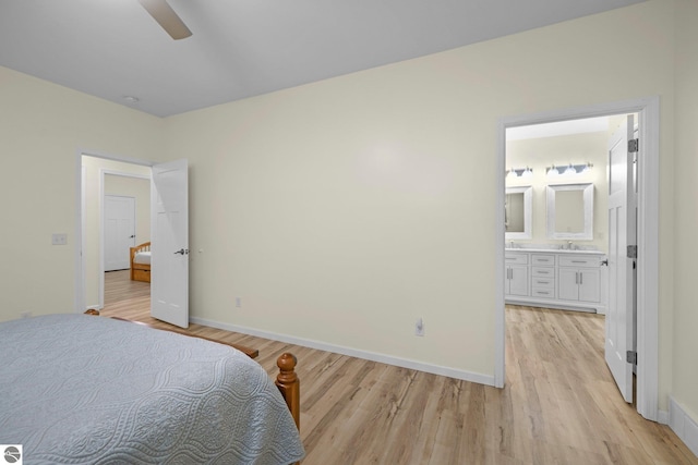 bedroom with connected bathroom, ceiling fan, and light hardwood / wood-style flooring