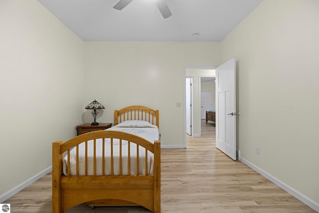 bedroom with ceiling fan and light wood-type flooring