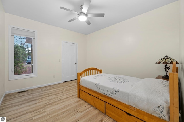 bedroom with light wood-type flooring and ceiling fan