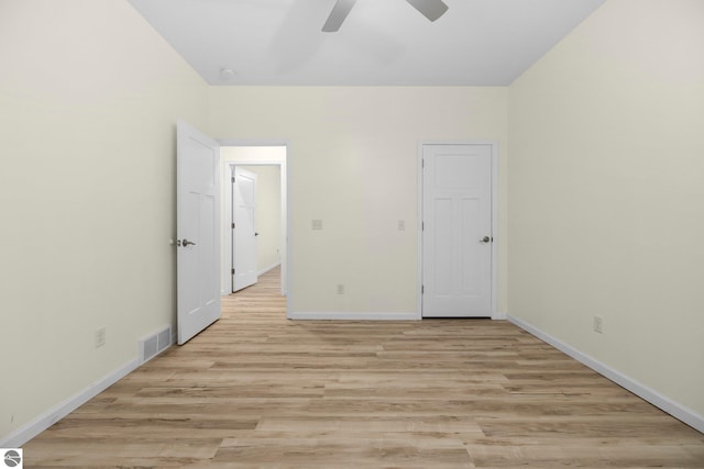 unfurnished bedroom with light wood-type flooring and ceiling fan