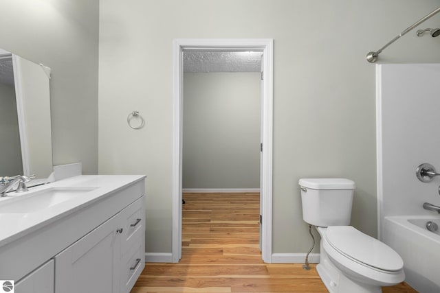 full bathroom featuring wood-type flooring, vanity, shower / bath combination, and toilet