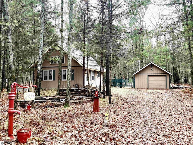 view of front facade featuring an outbuilding and a garage