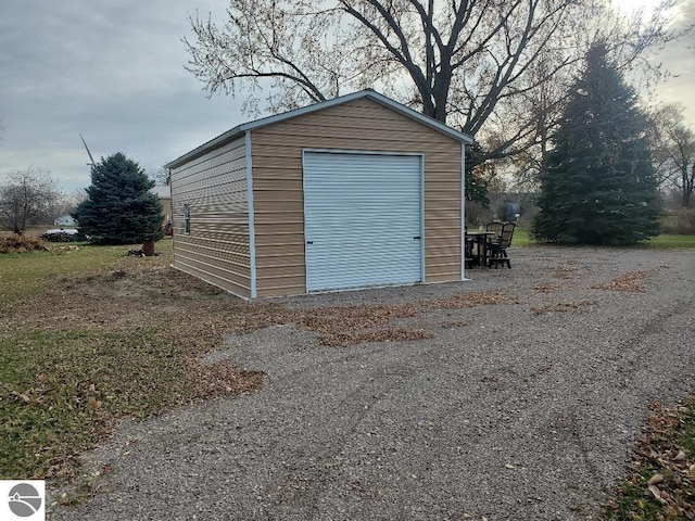 view of outbuilding featuring a garage