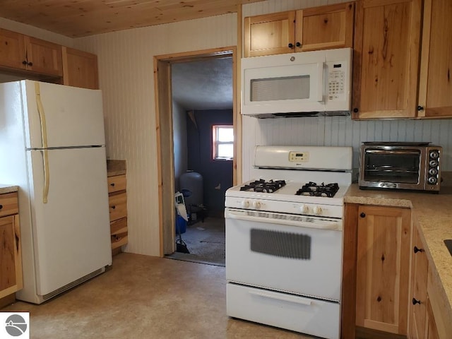 kitchen featuring white appliances and wooden ceiling