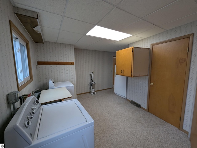 laundry area featuring light carpet and independent washer and dryer