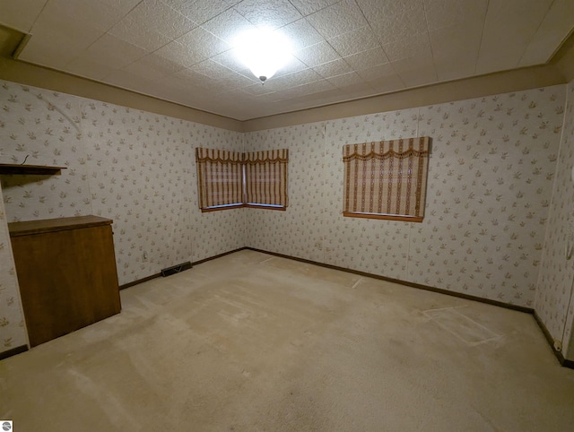 unfurnished room featuring carpet floors