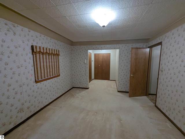 carpeted spare room with a textured ceiling