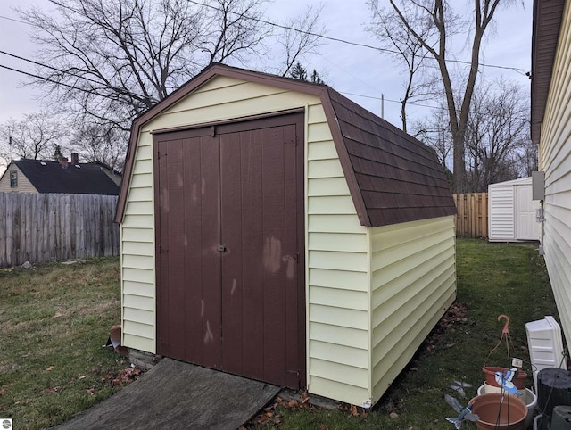 view of outdoor structure with a lawn