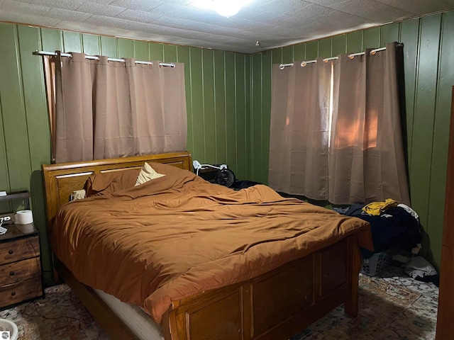 bedroom with wood walls