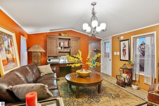 living room featuring hardwood / wood-style floors, lofted ceiling, crown molding, and a chandelier