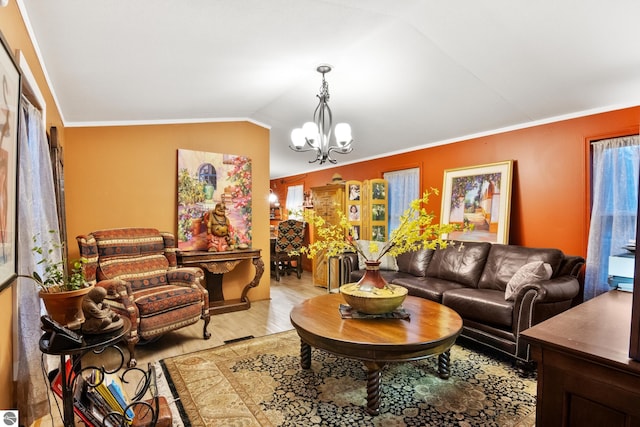 living room with crown molding, light hardwood / wood-style flooring, vaulted ceiling, and an inviting chandelier