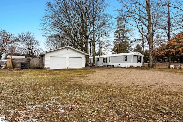 exterior space featuring a garage and a front yard