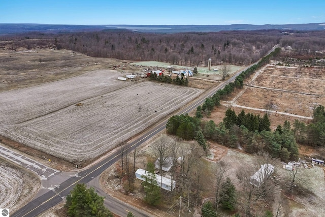 birds eye view of property with a rural view