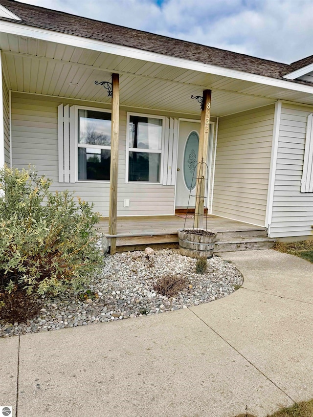 doorway to property featuring covered porch