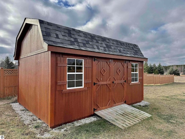 view of outbuilding with a lawn