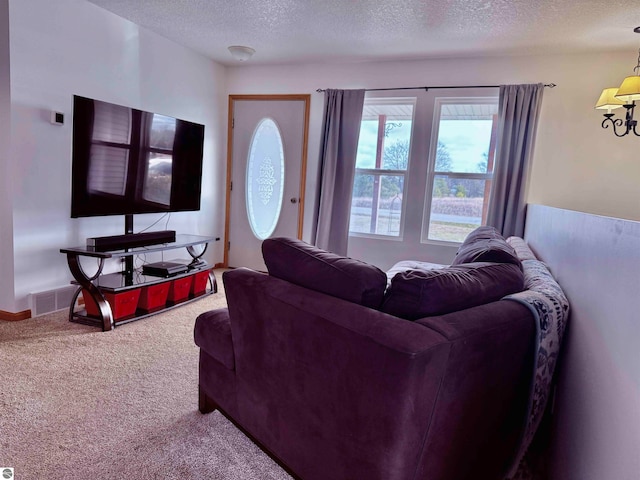 living room with carpet and a textured ceiling