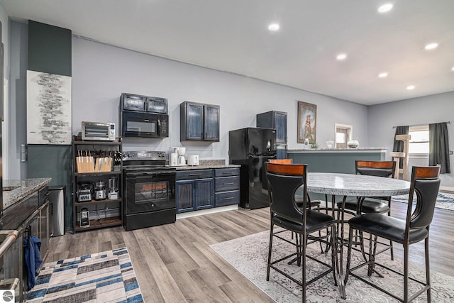 dining space featuring light hardwood / wood-style floors