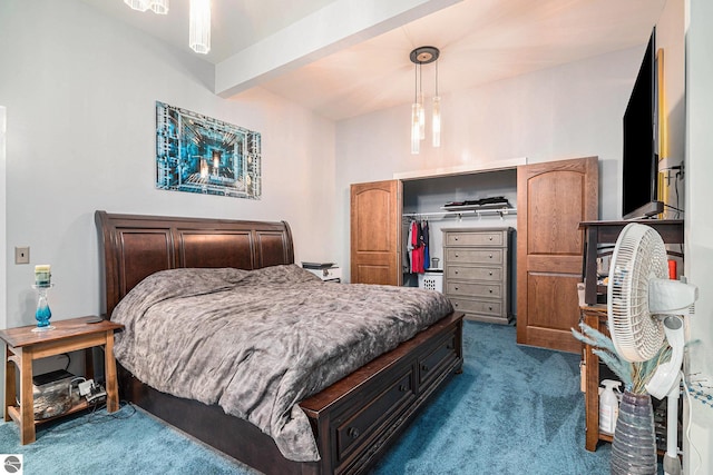 carpeted bedroom with a closet and beamed ceiling