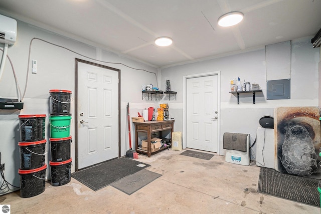 garage with a wall unit AC and electric panel