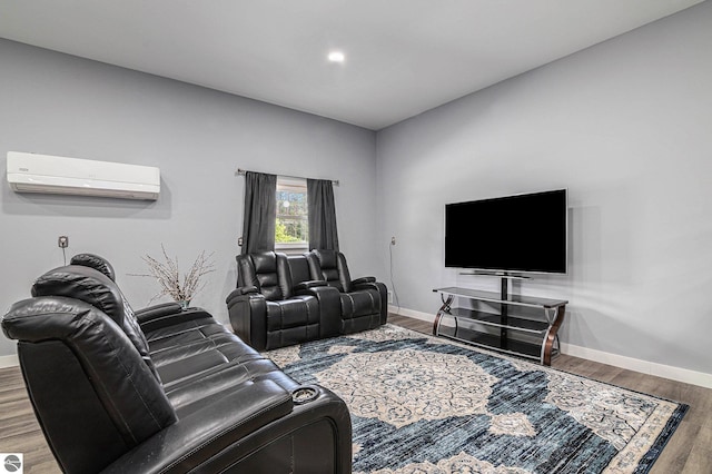 living room featuring wood-type flooring and an AC wall unit