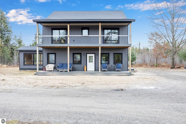 view of front of home featuring outdoor lounge area and a balcony