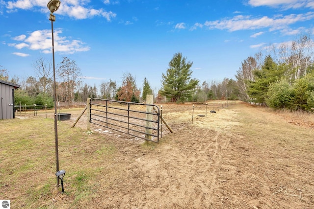 view of gate featuring a rural view